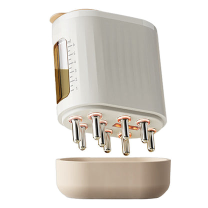 White and beige kitchen appliance with multiple nozzles on a white background