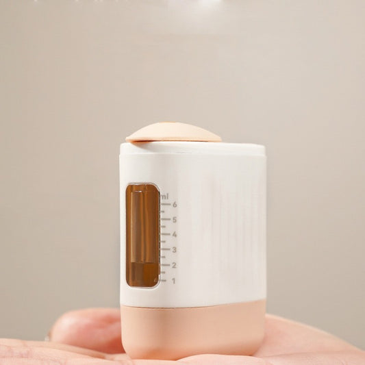Small white container with a wooden top held in a hand against a neutral background